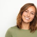 portrait of a young happy woman smiling on white background portrait of a young happy woman smiling on white background